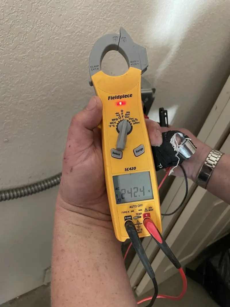 Voltage testing with clamp meter during Whole House Surge Protector in Wakefield
